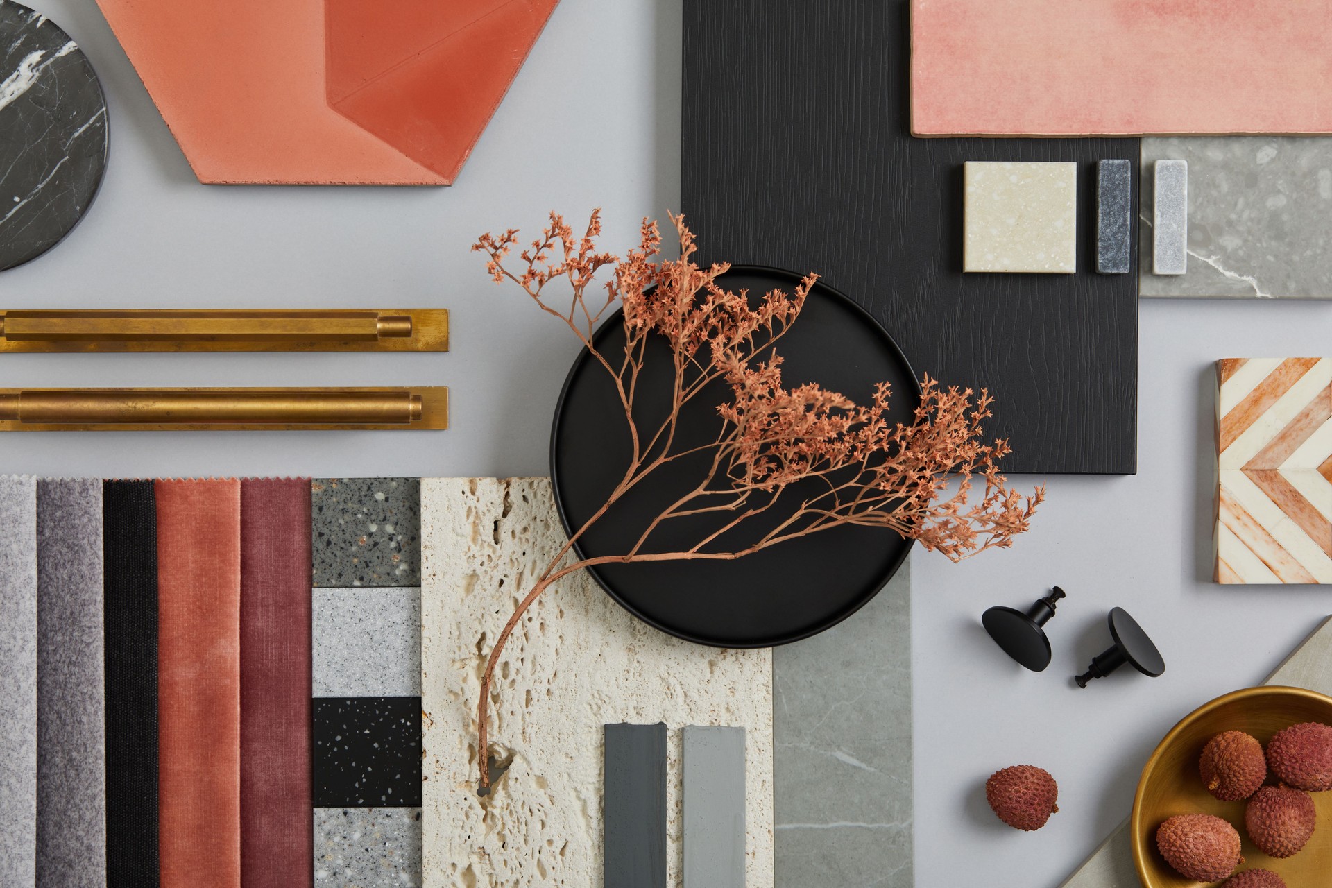 Creative flat lay composition with textile and paint samples, panels and tiles. Stylish interior designer moodboard. Pink, black and light grey color palette. Copy space. Template.